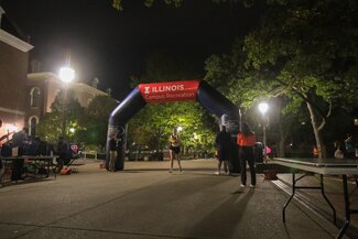 Runner going under the blow up arch